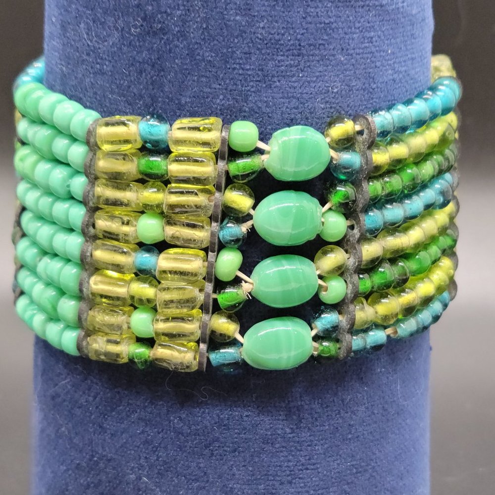 Multi-strand green, turquoise and blue glass bead elastic bracelet